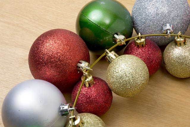 How to Make a Christmas Wreath out of a Coat Hanger by Putting Christmas Balls on It | eHow