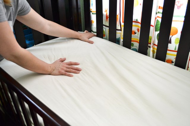 can you elevate crib mattress