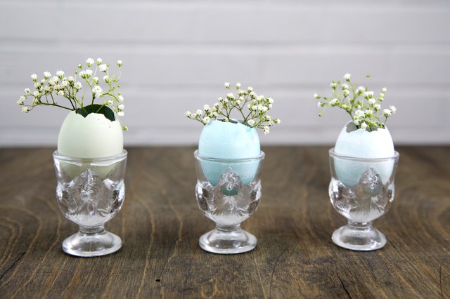 Hollow eggs used as miniature vases.