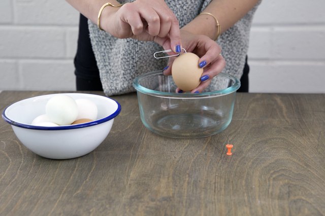 Use a paperclip to mix the yolk into the white of the egg.