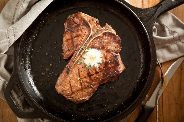 T-bone steak in pan. T-bone steak in pan.