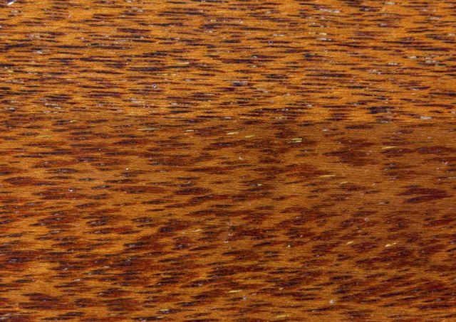 Close-up of a finished merbau wood surface Close-up of a finished merbau wood surface