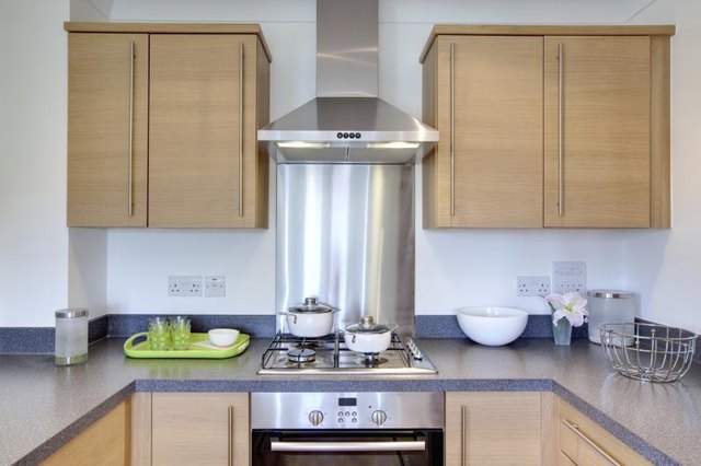 A kitchen with oak cabinets. A kitchen with oak cabinets.