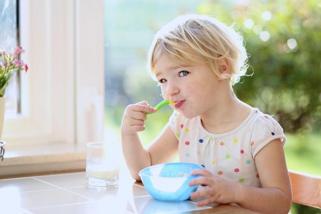 Toddler eating cereal Toddler eating cereal