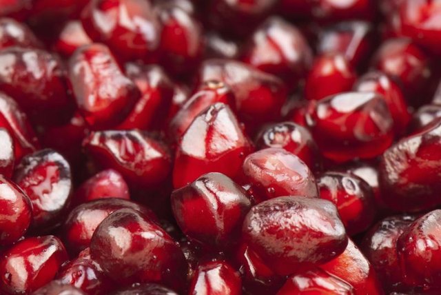 A close-up of pomegranate seeds. A close-up of pomegranate seeds.