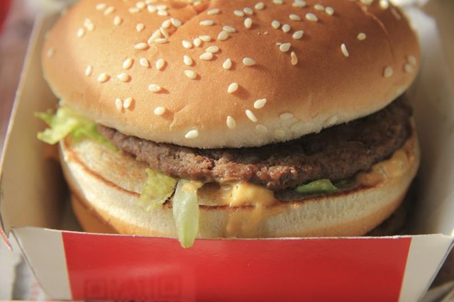 Hamburger in a container from a fast food restaurant. Hamburger in a container from a fast food restaurant.