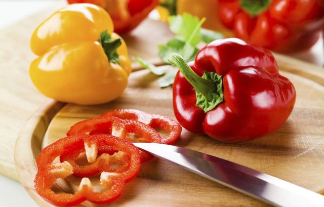 Peppers on a cutting board. Peppers on a cutting board.