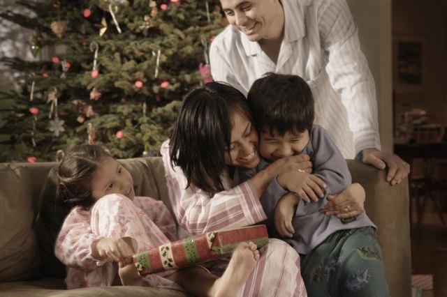 A family celebrates Christmas together. A family celebrates Christmas together.