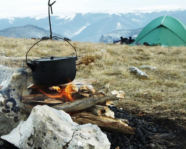 Cooking food at a campsite Cooking food at a campsite