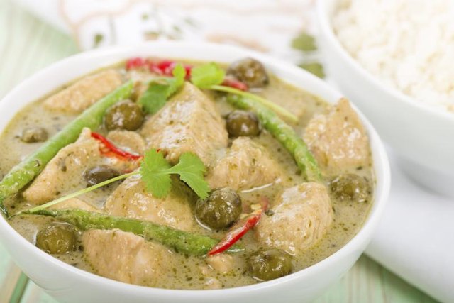 A Thai green curry with chicken and rice. A Thai green curry with chicken and rice.