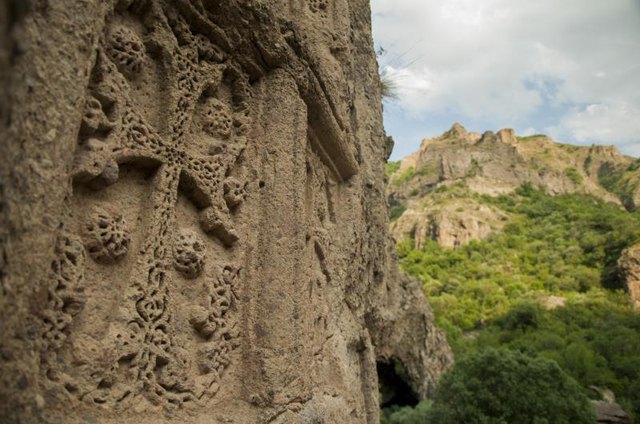 Close-up of medieval art carved into a large rock. Close-up of medieval art carved into a large rock.