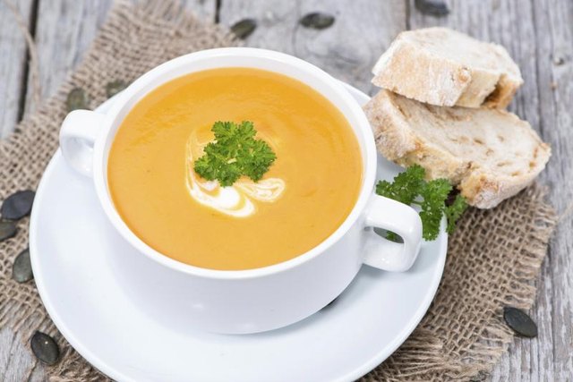 Bowl of creamy sweet potato soup. Bowl of creamy sweet potato soup.