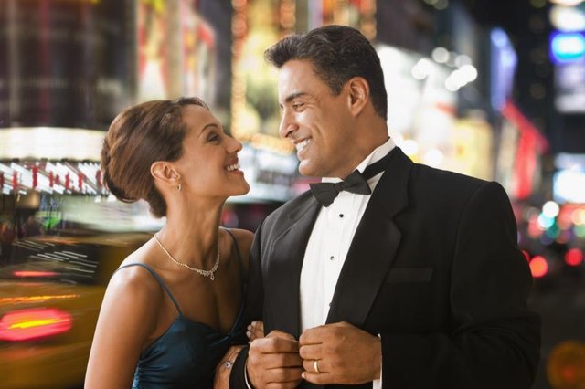Classic black tie calls for a tux and formal gown. Classic black tie calls for a tux and formal gown.