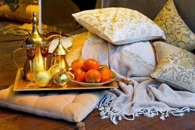 A collection of Moroccan style accessories in the center of a room. A collection of Moroccan style accessories in the center of a room.