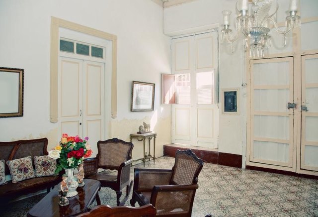 The interior of a British Colonial plantation living room. The interior of a British Colonial plantation living room.