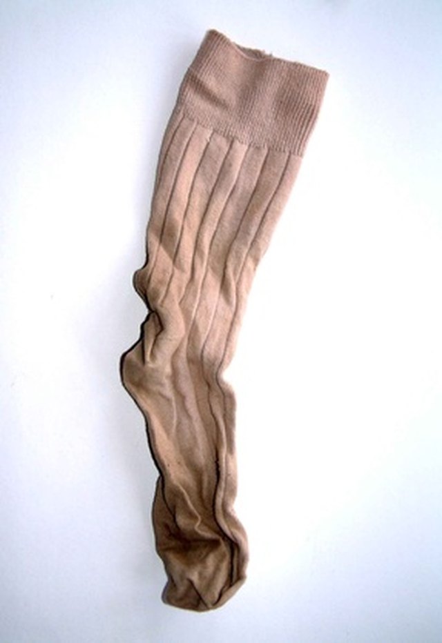Fill a long tube sock with rice.