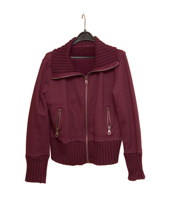 Make a woman's jacket larger by letting out the seams.