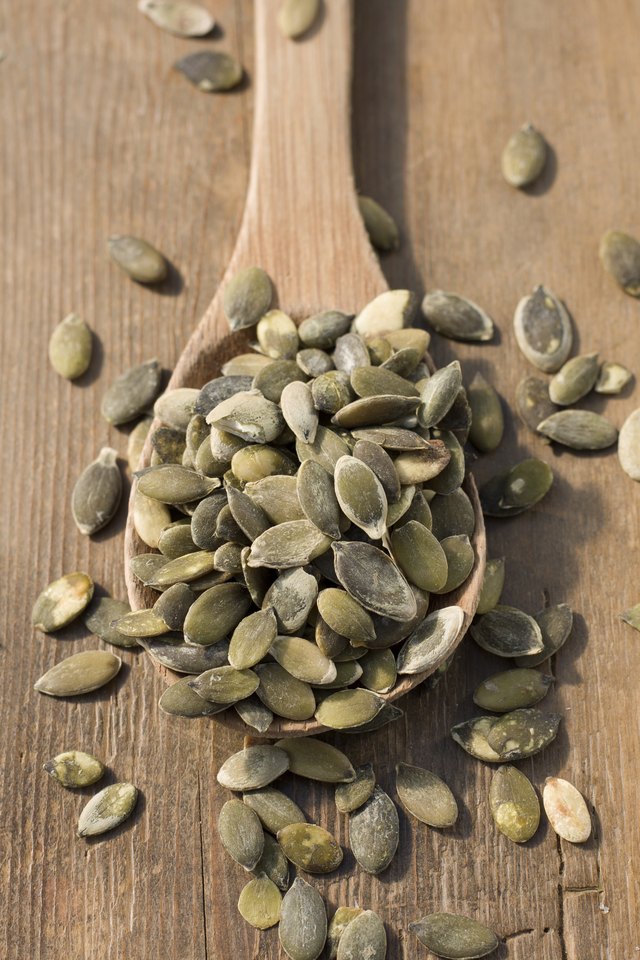 Roasted pumpkin seeds in spoon