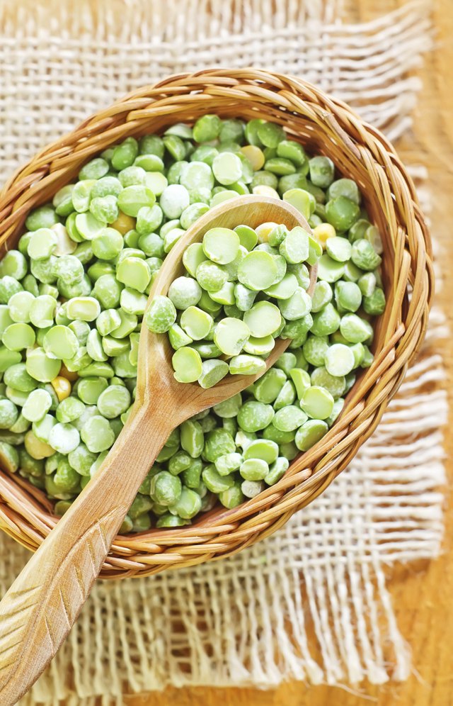 Dried peas in basket with spoon