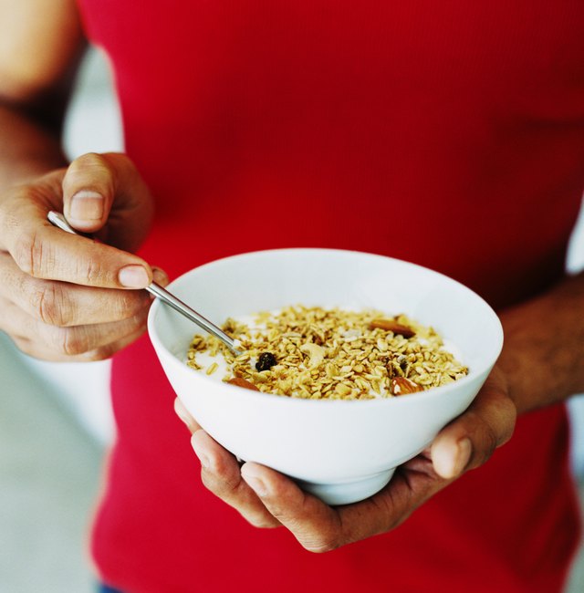 Man holding a bowl of cereal.