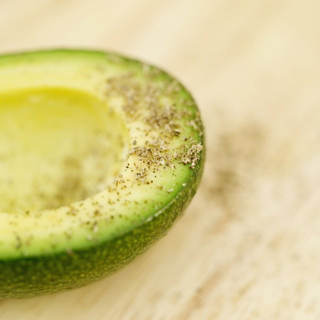 Close-up of peppered avocado slice.