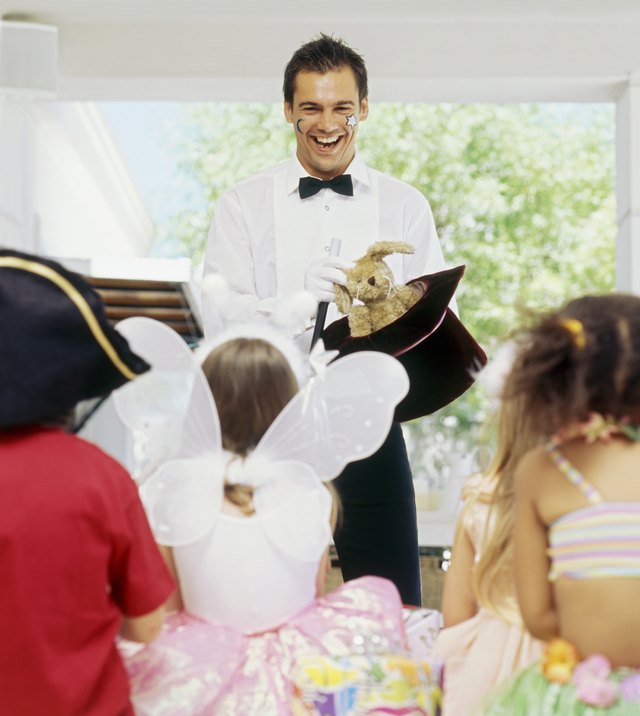 Magician performing at birthday party