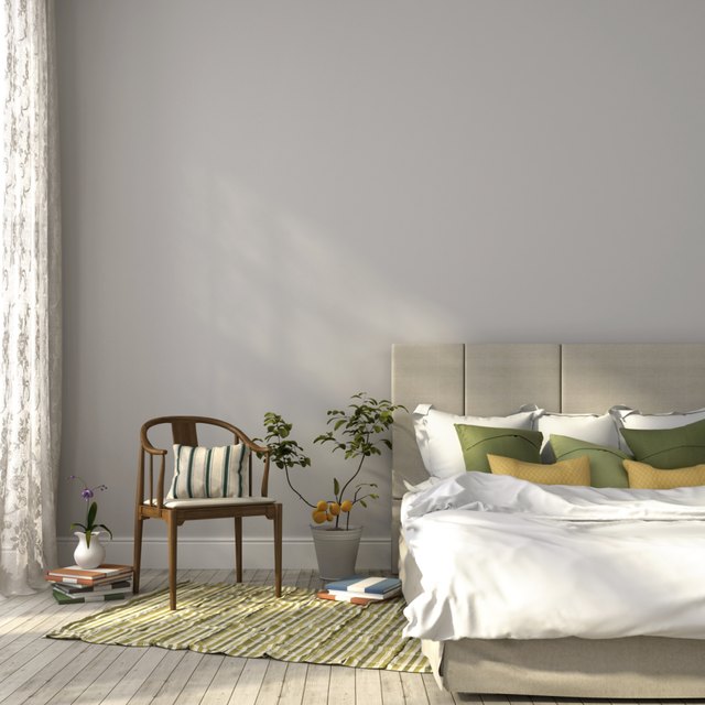 Simple bedroom painted with a grey and beige color scheme