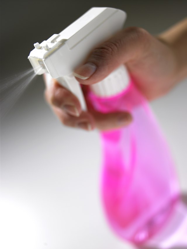Hold the misting bottle six inches from the suede item.
