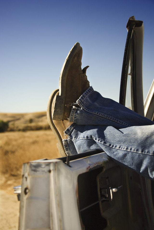You can cut the bottom seams of your jeans to fit your favorite pair of boots.