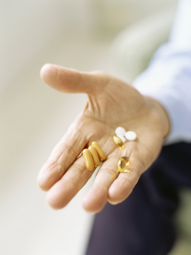 Fish oil capsules can be taken with your standard blood pressure medication to boost your health. Fish oil capsules can be taken with your standard blood pressure medication to boost your health.