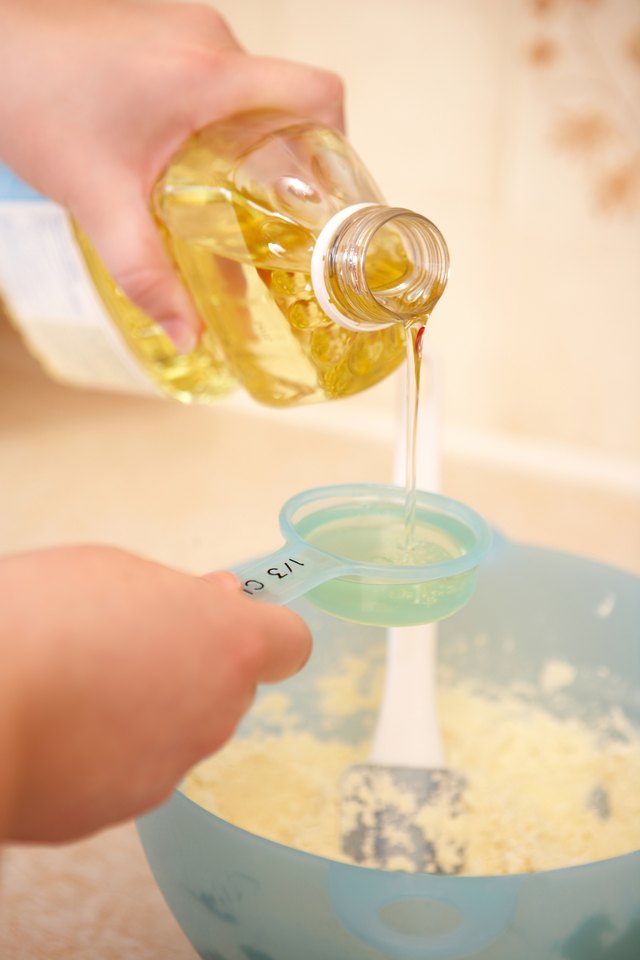 Pouring corn syrup into measuring cup