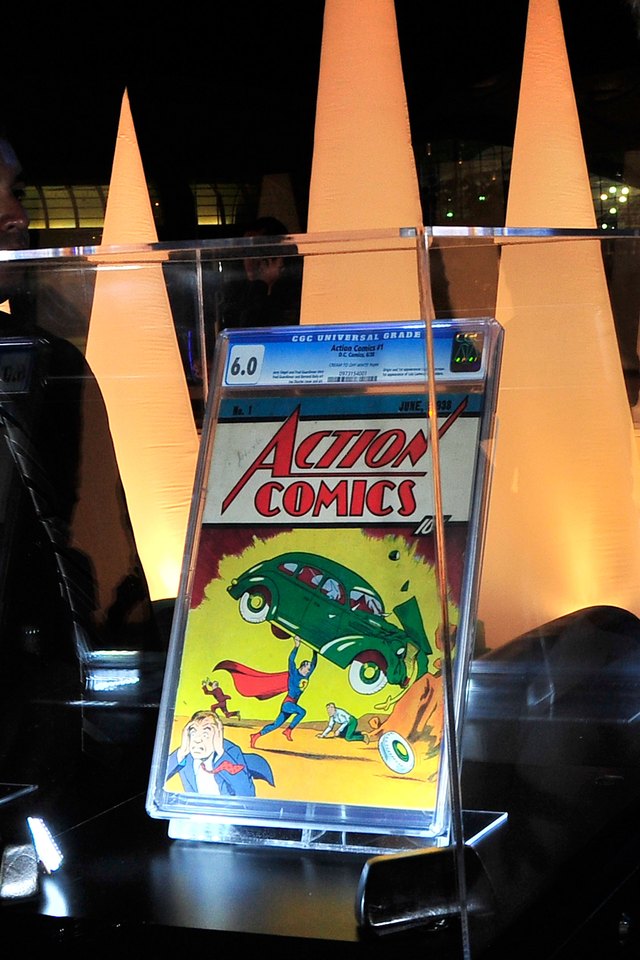 An original Superman comic book is on display in a glass case. An original Superman comic book is on display in a glass case.