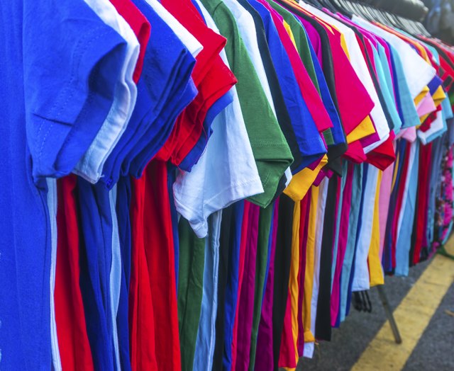 T-shirts hanging on rack.