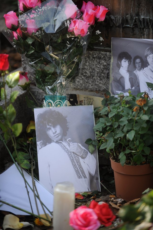 A photograph of The Doors lead singer, Jim Morrison, on an alter.