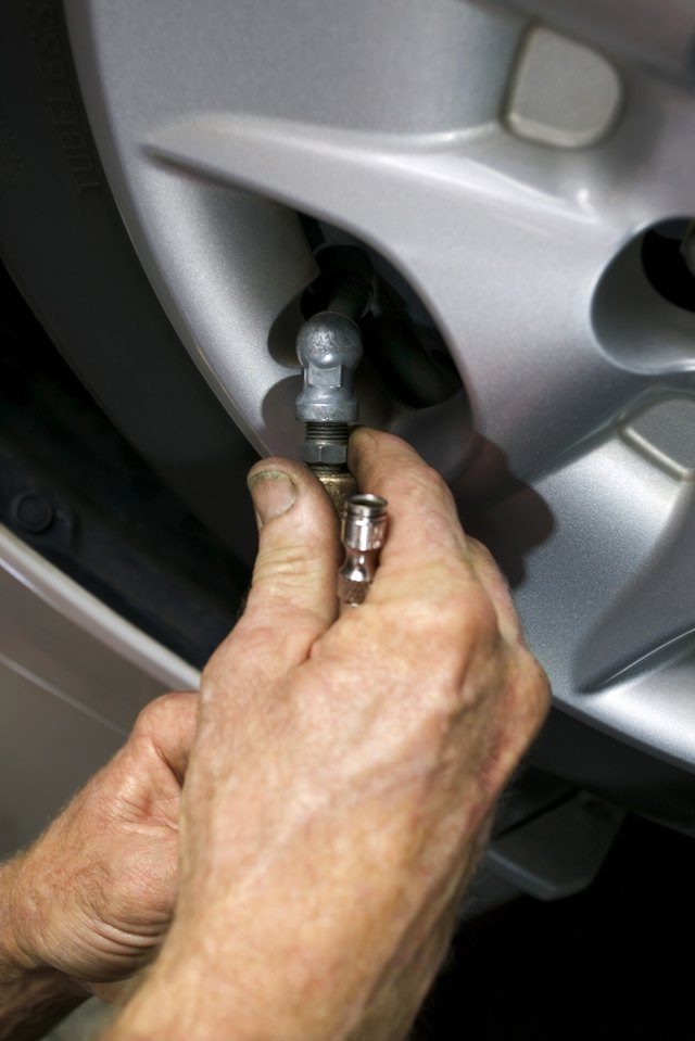 Remove the air hose and the wire connectors from the pressure switch.
