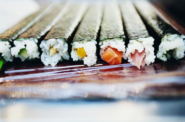 Several rolls of seaweed wrapped sushi.