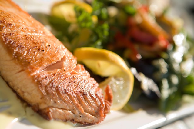 Salmon with a side of vegetables.