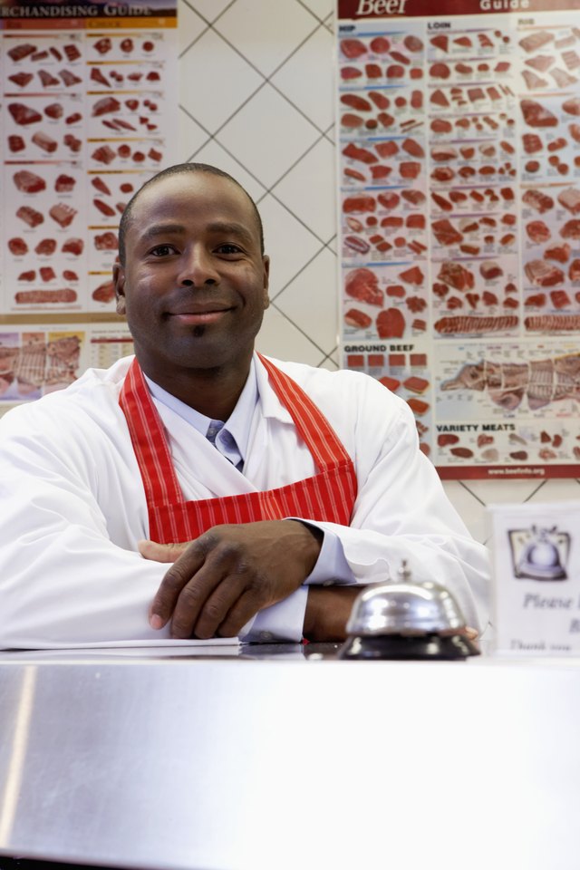 Butcher at grocery store deli