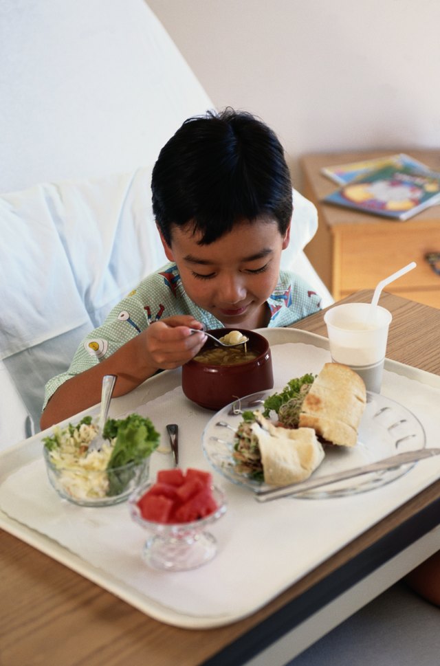 A dietary aide may set up food trays.