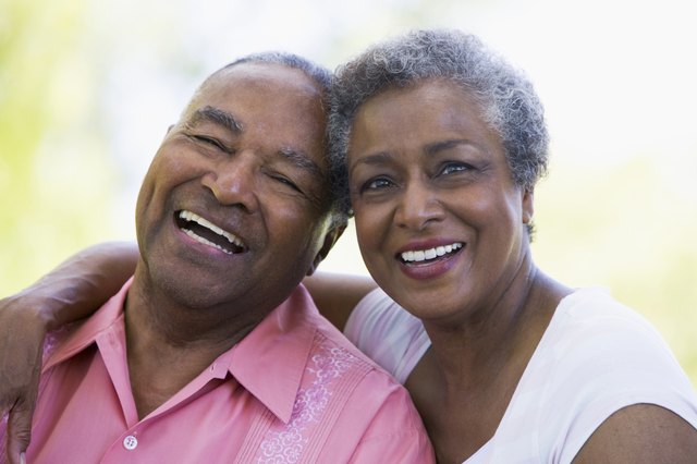 A happy couple poses for a portrait.