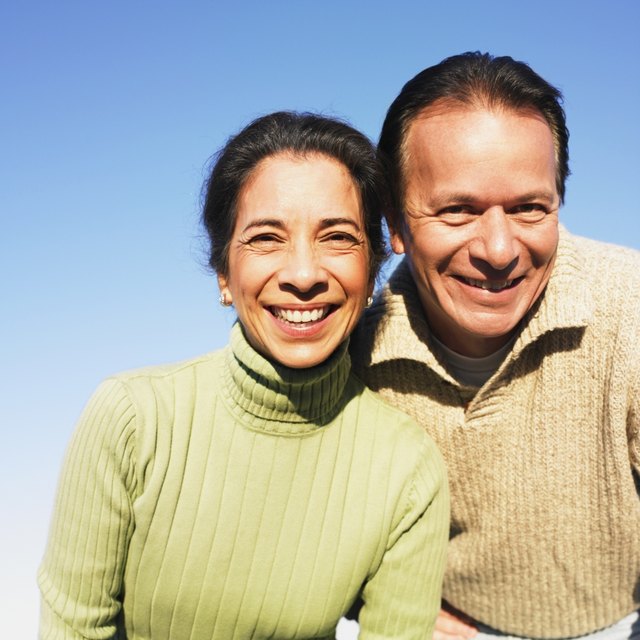 A close-up of a happy couple outside. A close-up of a happy couple outside.