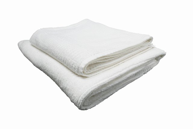 Use a cotton-based towel that has not been dried with fabric softener for the best absorbency.