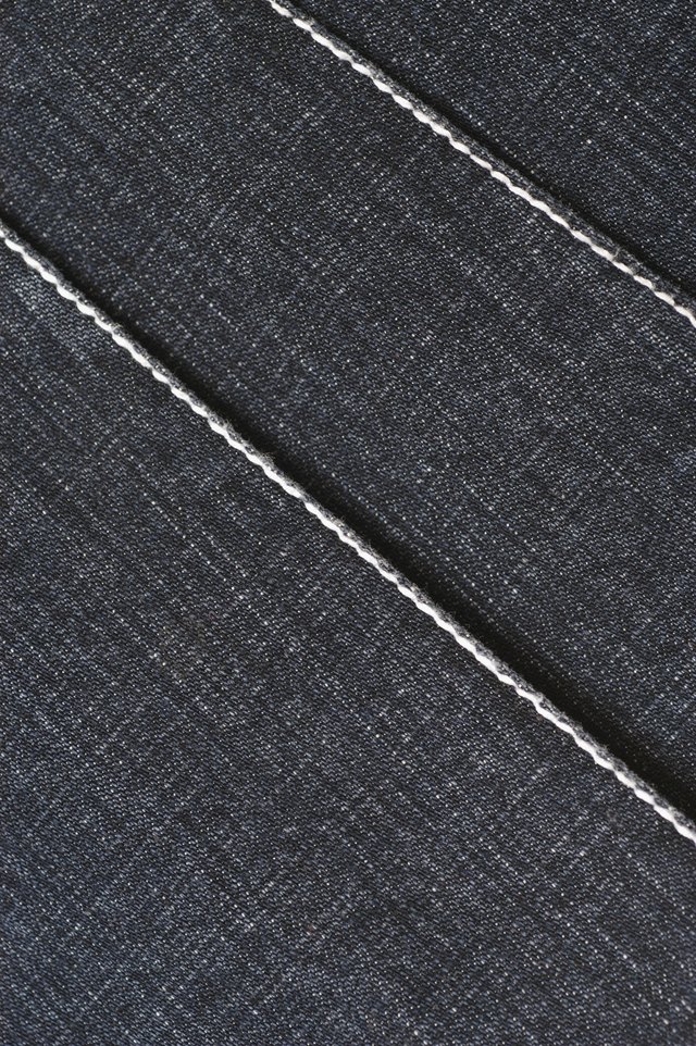 You can use regular household bleach to lighten black denim jeans.