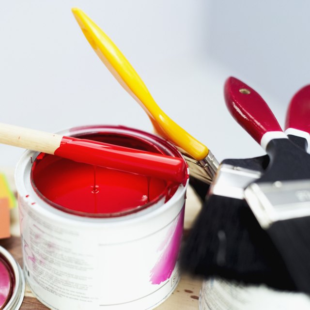 Large can of red paint.