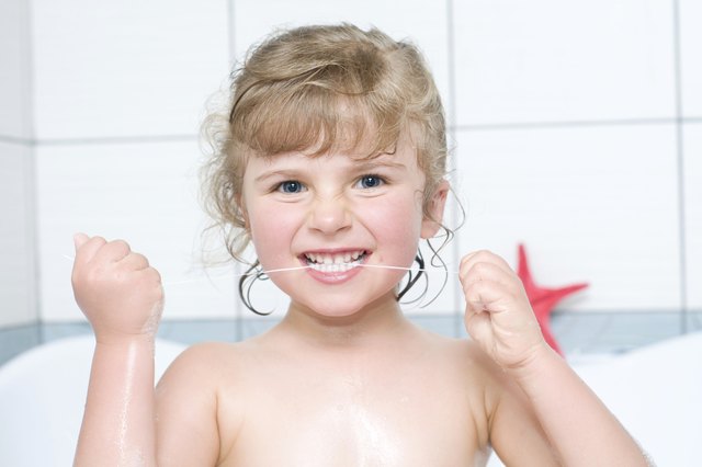 Teach your child how to floss properly.