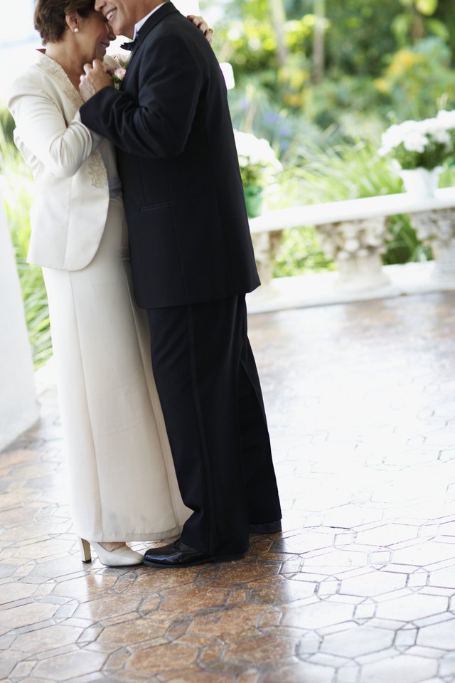 The mother and father of the bride dance together.