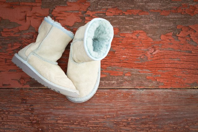 Spot clean sheepskin slippers by blotting stains with a clean, damp rag.