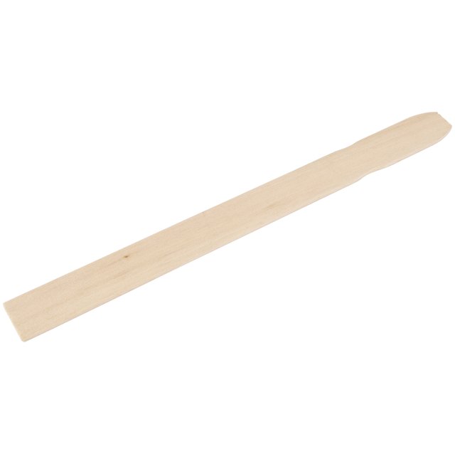 A paint stir stick is an inexpensive cleaning tool.