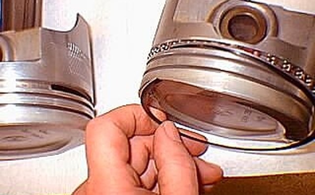Top spring scraper ring first