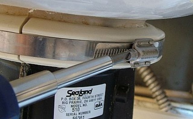 Remove large hose clamp to separate china bowl from pedestal.